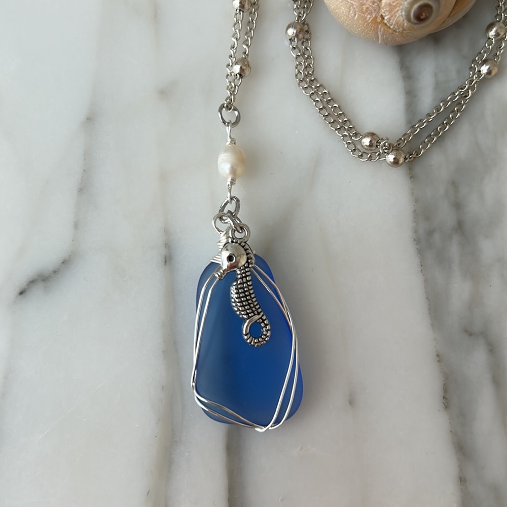 New Handmade Sea glass necklace with Fresh water Pearl and charm. Blue sea glass